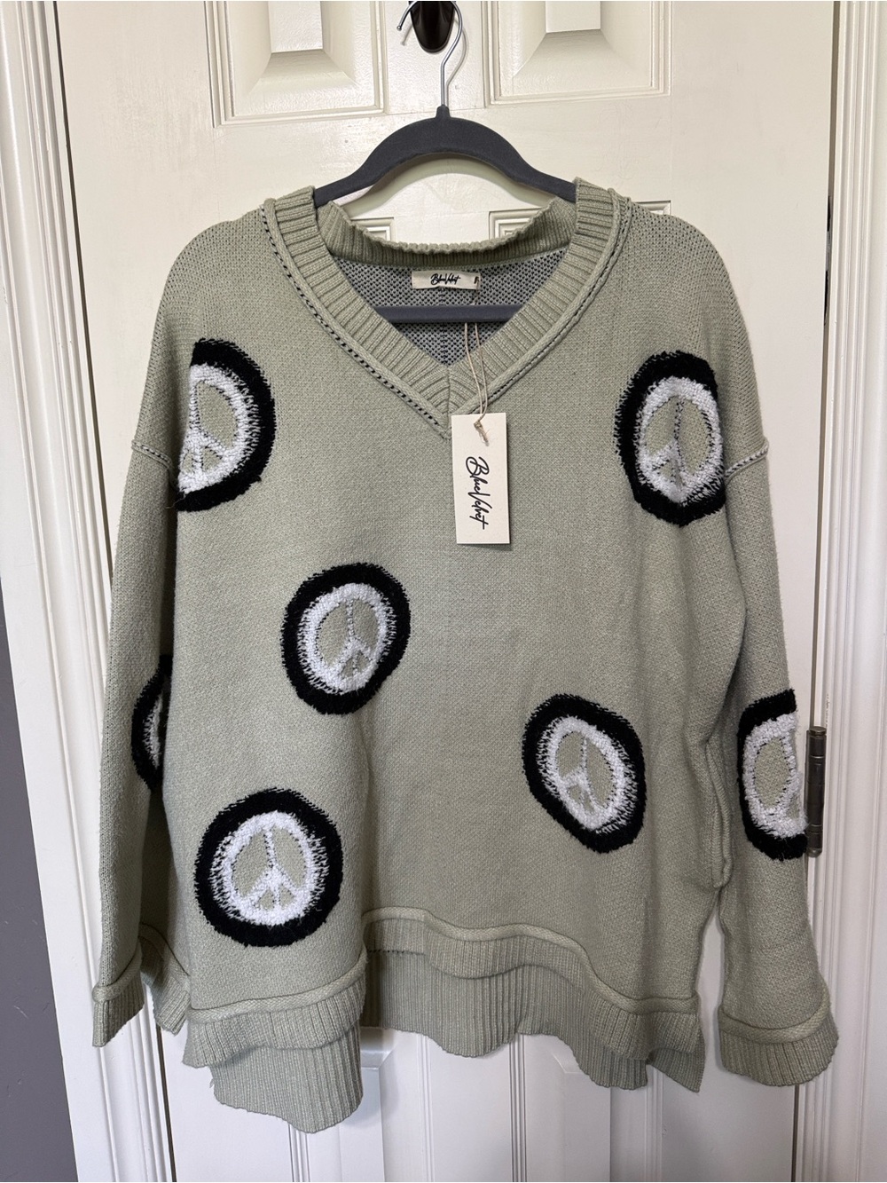 Blue Velvet Relaxed V-Neck Sweater in Olive Green with Peace Sign Motifs